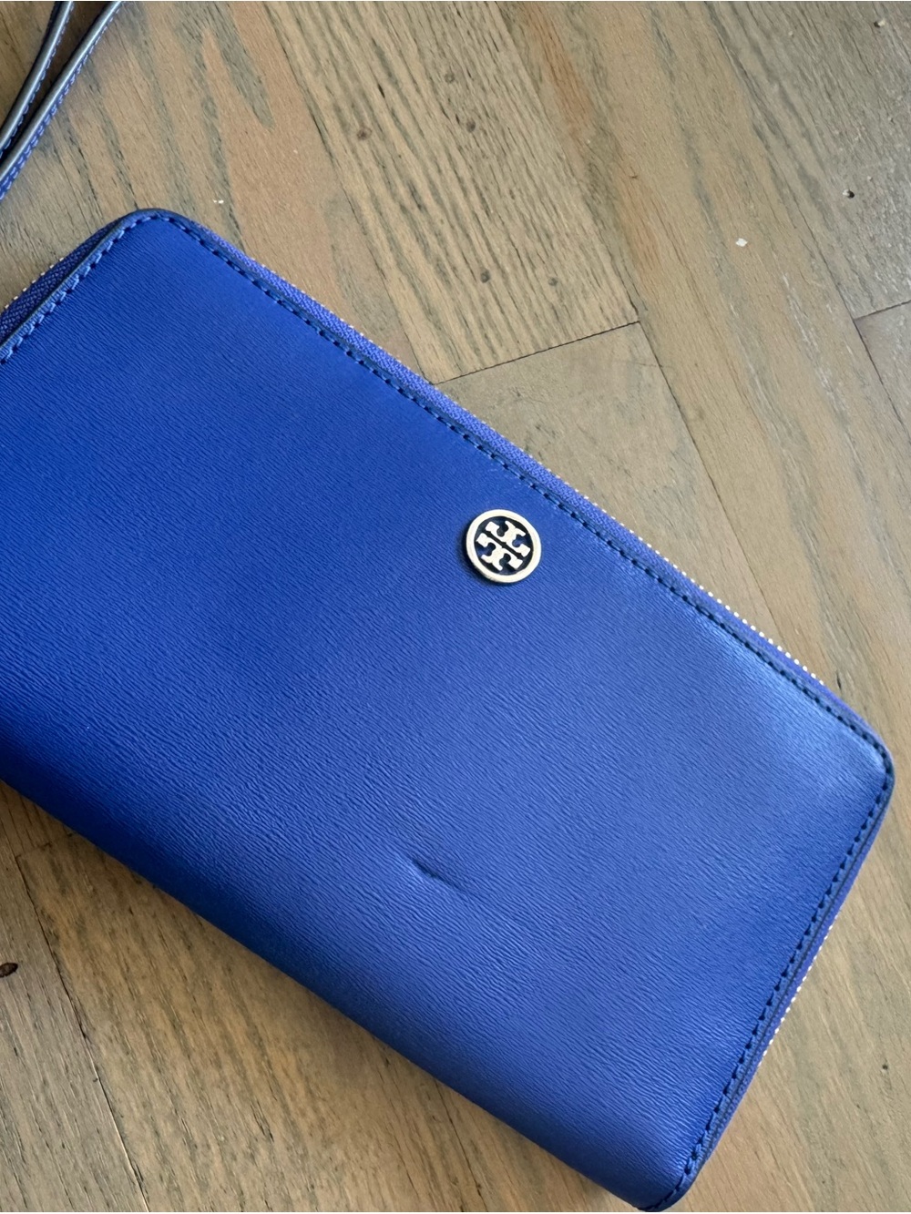 Tory Burch cobalt blue zip-around wallet with logo